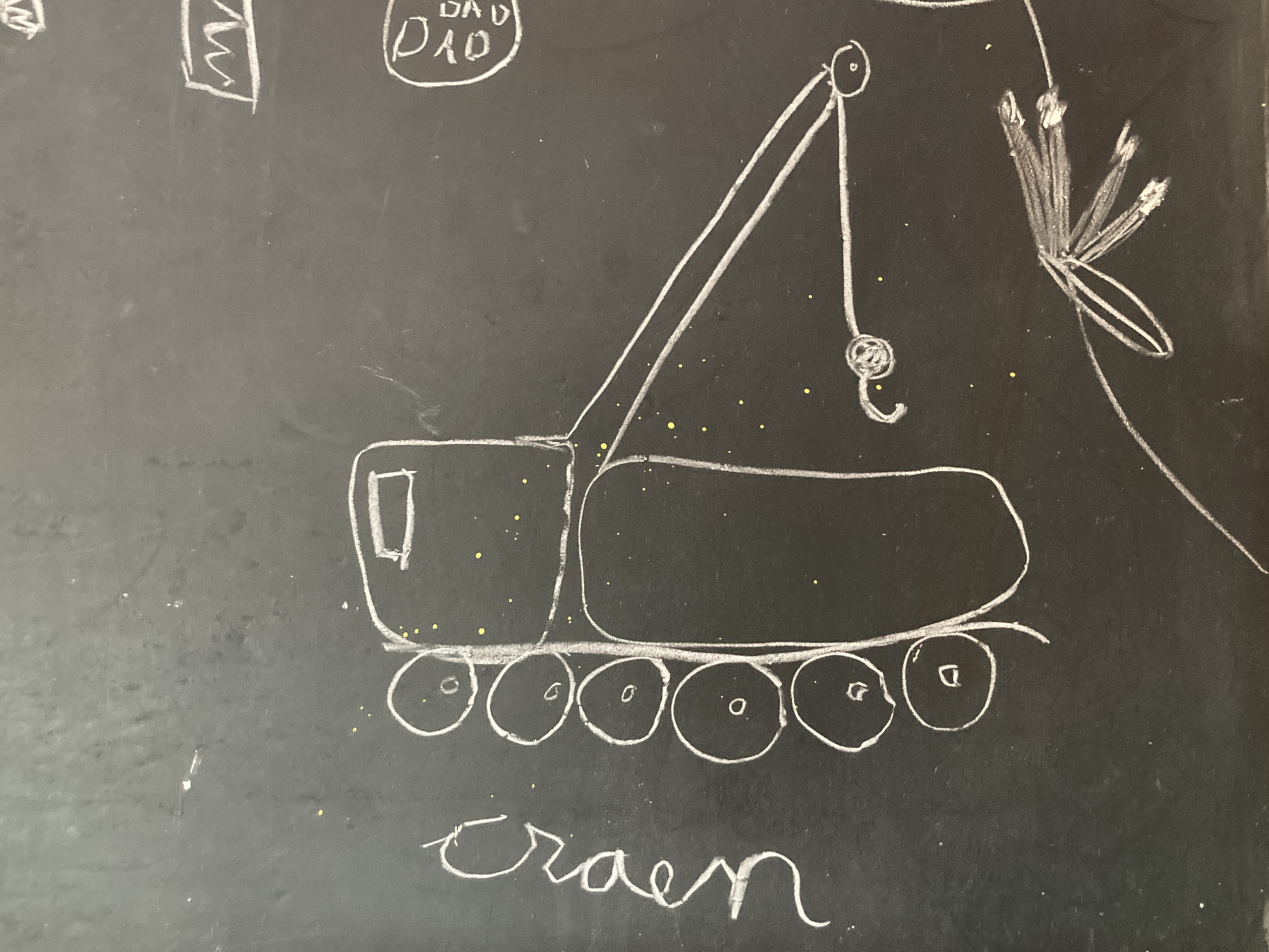 Drawing of crane on chalkboard.